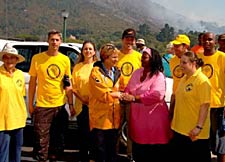 Scientology volunteers take time out from fire for photo op